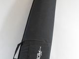 a black bag that is sitting on a white wall