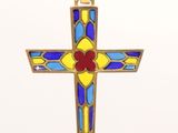 a close up of a cross on a white surface with a white background