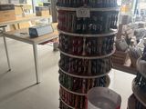 many cans of beer stacked on top of each other in a store