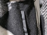 a close up of a woman ' s coat with a belt