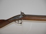 an old gun that is on display in a museum