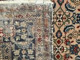 a close up of two rugs with different colors and patterns