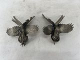 pair of antique silver plated bird figurines on white background