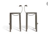 pair of metal side tables with a metal frame and rope