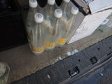 six bottles of water sitting in the trunk of a car
