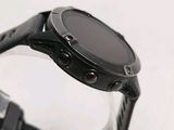 a close up of a smart watch with a black band