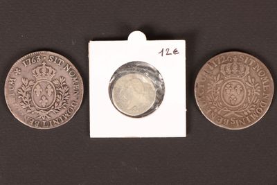 three coins are shown next to each other on a black surface