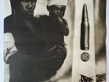 an old black and white photo of a man holding a gun next to a bullet