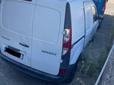 a white van that is parked on the side of the road