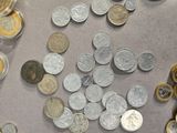 a lot of coins that are on the table