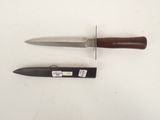a knife and a knife holder on a white surface