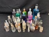 a lot of bottles with different colored liquids in them