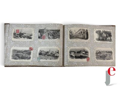an open book with pictures of a city on it