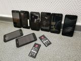 a lot of cell phones that are sitting on the floor