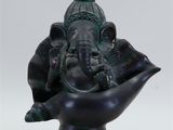 statue of an elephant in a bowl on a white background
