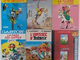 six livres pour enfants sont alignés sur une surface blanche