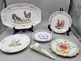 many plates and spoons that are on a table