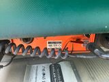 a close up of a green vehicle with some wires attached to it