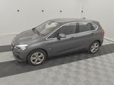 a picture of a grey car parked in a garage