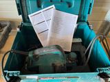 a blue tool box with some papers in it