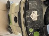 someone is using a vacuum to clean the floor of a bathroom
