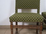 pair of green upholstered chairs with wooden legs and a green upholstered chair