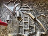 a lot of old kitchen utensils on the counter
