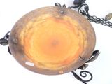 an image of a metal bowl with a chain around it