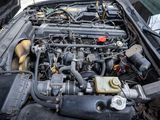 a picture of a car engine with its hood open