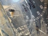 a close up of a car dashboard with a clock on it