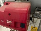 a red box sitting on top of a cart in a garage