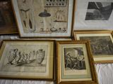 four framed pictures on a table with pictures on it