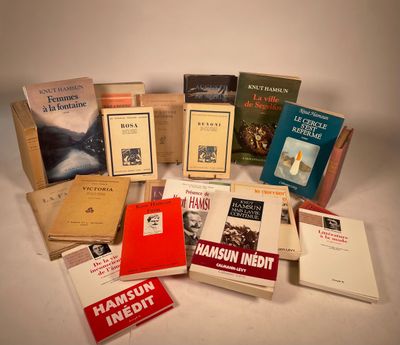 several books are stacked on top of each other on a table