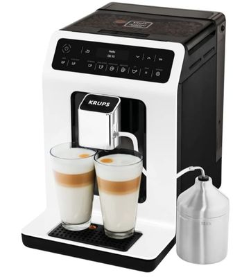 a white coffee machine with two cups of coffee next to it