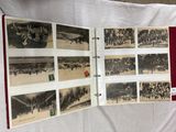 a lot of old photographs on the table