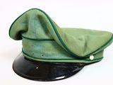 a green hat on a black base on a white background