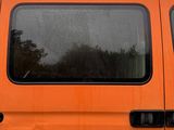 an orange van that is parked on the side of the road