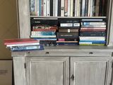 a book shelf with a lot of books on top of it