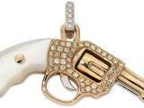 an image of a gold and white gun with diamonds on it