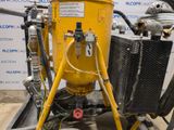 an image of a machine with a hose attached to it ' s side