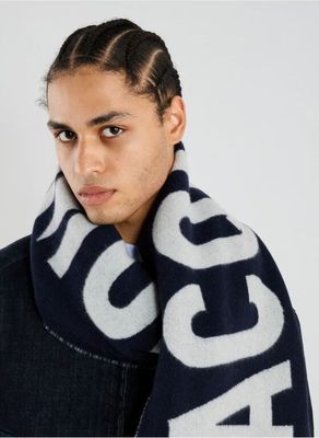 a picture of a young man wearing a scarf and jacket
