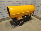 an electric heater sitting on top of a cart in front of a wall