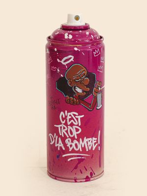 pink spray can with graffiti on it that says get trip d ' u bomb