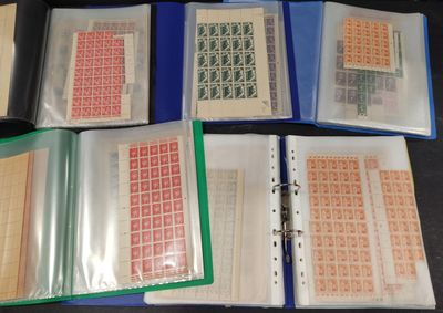 five binders with stamps on them on a table