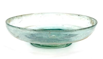 a glass bowl sitting on top of a white table