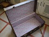 an open suitcase sitting on the floor in a room