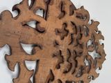 a wooden fish that is hanging on the wall