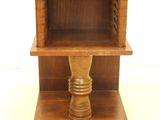 a small wooden table with a shelf on top of it