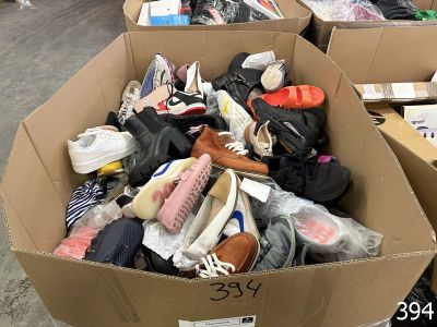 a box full of shoes that are sitting on the floor
