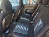 four seats in the back of a car that are empty